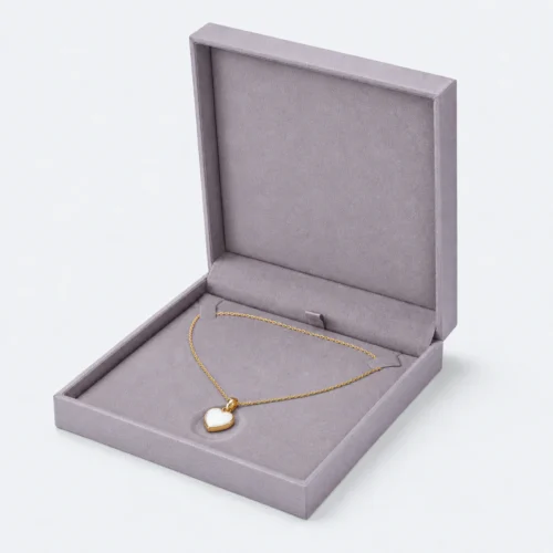 Open gray lilac linen necklace box with two chain tabs and centered heart pendant