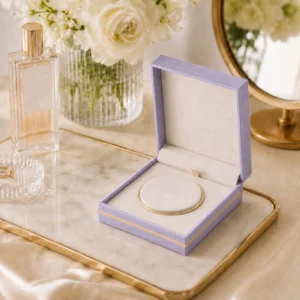 custom velvet fabric hinged jewelry box image 05 usage scene JB-BM-02-P4 Lavender bangle box with clean cream insert in a warm vanity tabletop setting