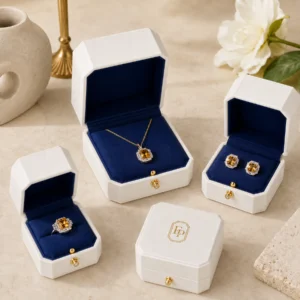 White leather jewelry box collection with navy inserts and blank inner lids