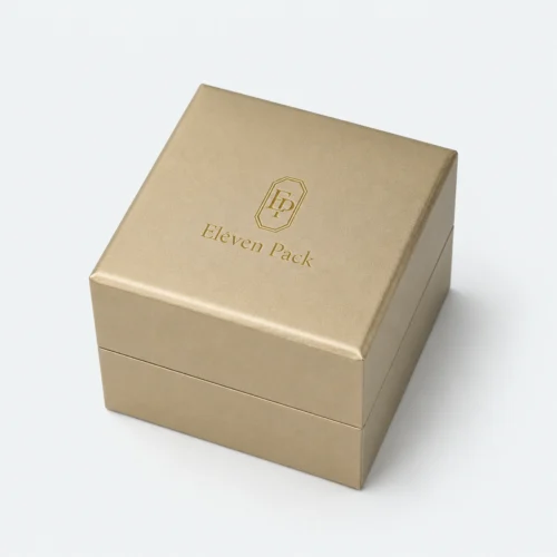 Closed champagne gold PU leather ring box with centered gold logo