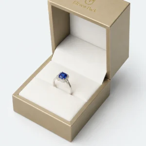 custom champagne gold pu leather ring box image 03 ring slot JB-BM-05-P23 Close-up of white cushion seam holding a blue gemstone ring