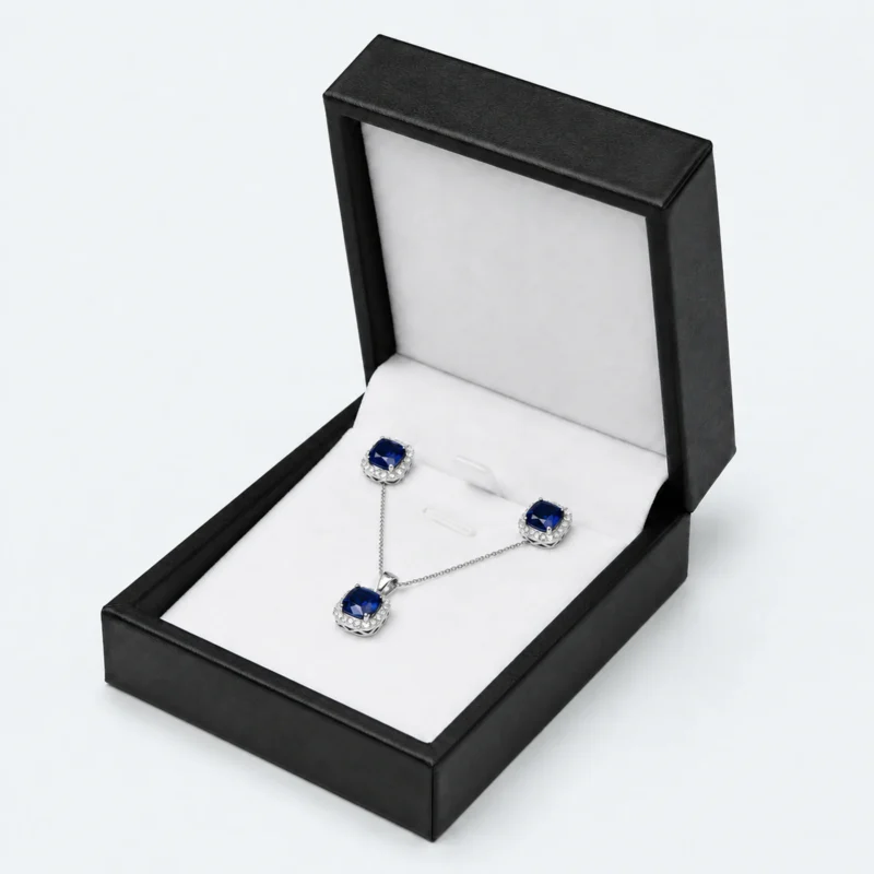 custom black pu leather necklace box image 01 main open JB-BM-05-P24 Open black PU leather necklace box with white fitted insert and blue jewelry set