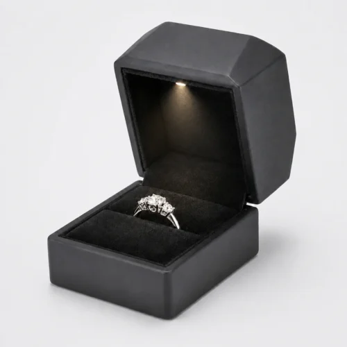 Open black PU leather LED ring box with illuminated ring and blank inner lid