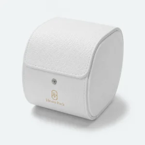 Closed white leather watch box with rounded profile and gold logo