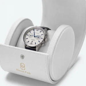 Close-up of the padded watch holder inside a white leather travel box