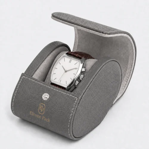 Open gray leather travel watch box with realistic white baton-marker watch dial