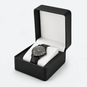 Open black genuine leather watch box with pale padded cushion and blank inner lid