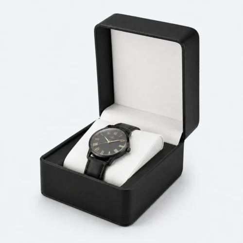 Open black genuine leather watch box with pale padded cushion and blank inner lid