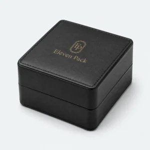 Closed black genuine leather watch box with stitched lid and gold logo
