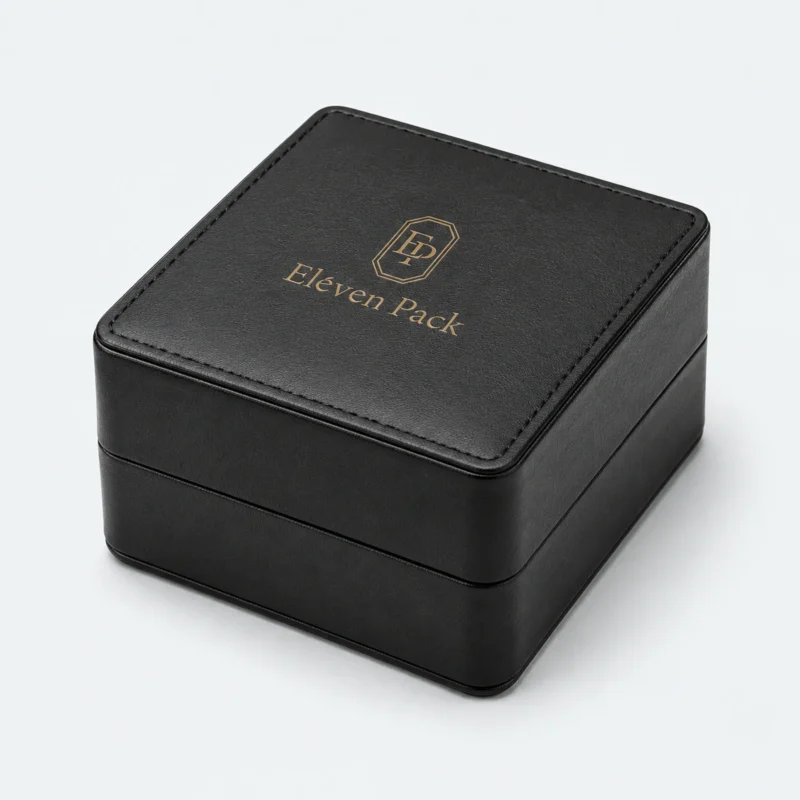 Closed black genuine leather watch box with stitched lid and gold logo