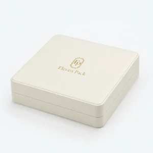 Closed white genuine leather jewelry box with stitched edge and gold logo