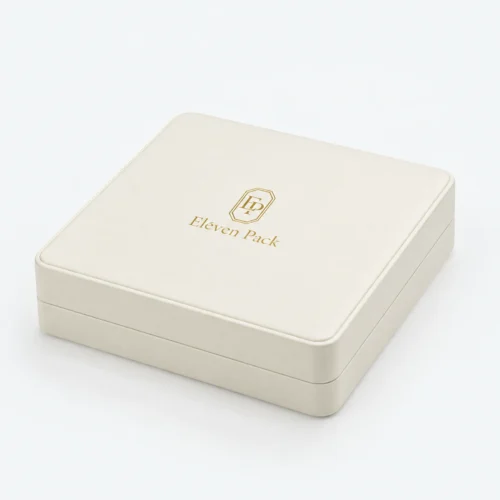 Closed white genuine leather jewelry box with stitched edge and gold logo