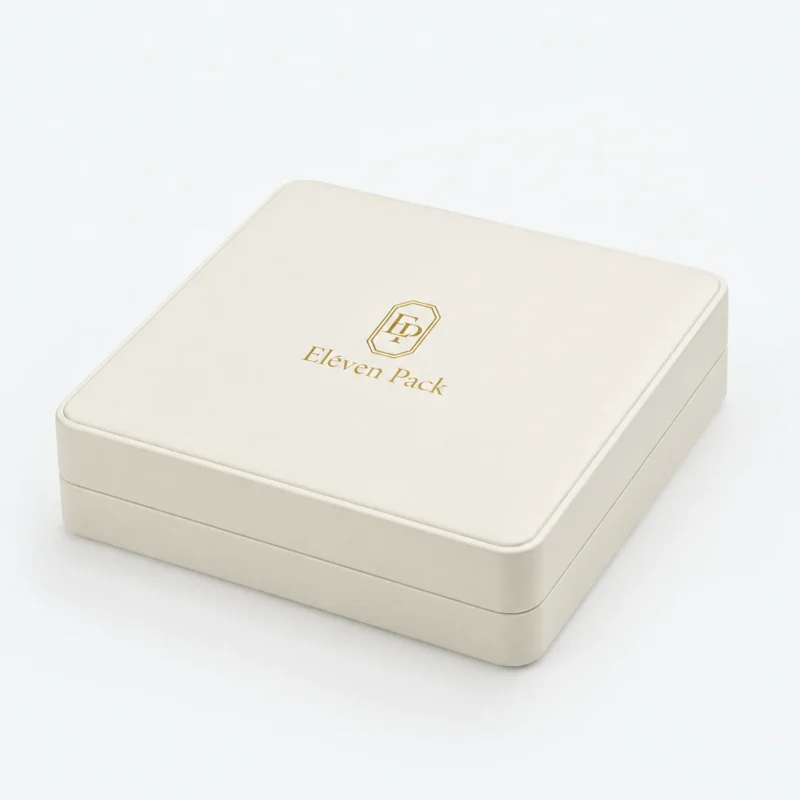 Closed white genuine leather jewelry box with stitched edge and gold logo