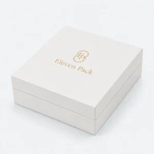 Closed white PU leather necklace box with gold Eleven Pack logo