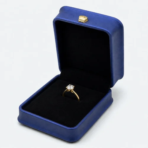 Open blue PU leather ring box with flat black insert and crown clasp