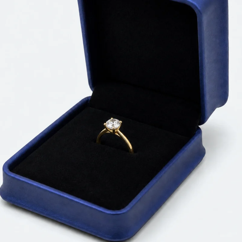 Close-up of a ring held in the short slit of the flat black insert