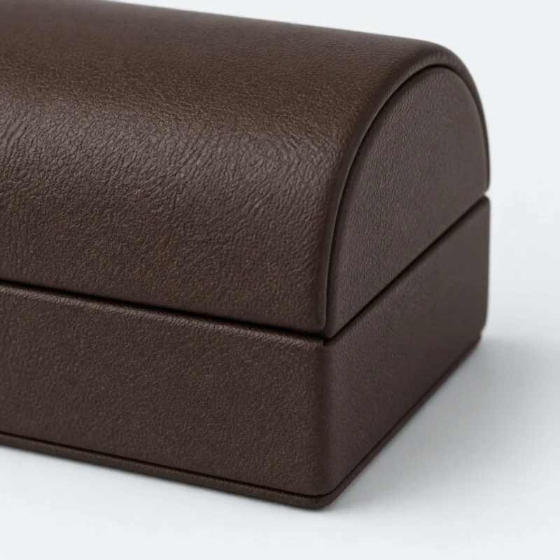 Brown genuine leather earring box showing the leather seam detail