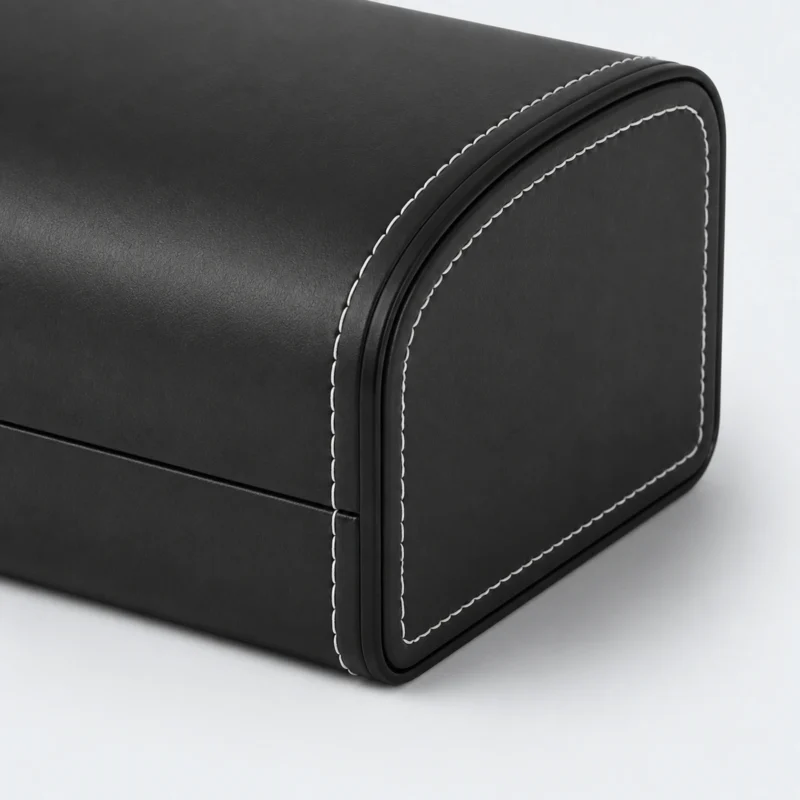 Black genuine leather watch box showing the stitched shell detail