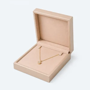 Open champagne PU leather necklace box with pendant necklace displayed inside