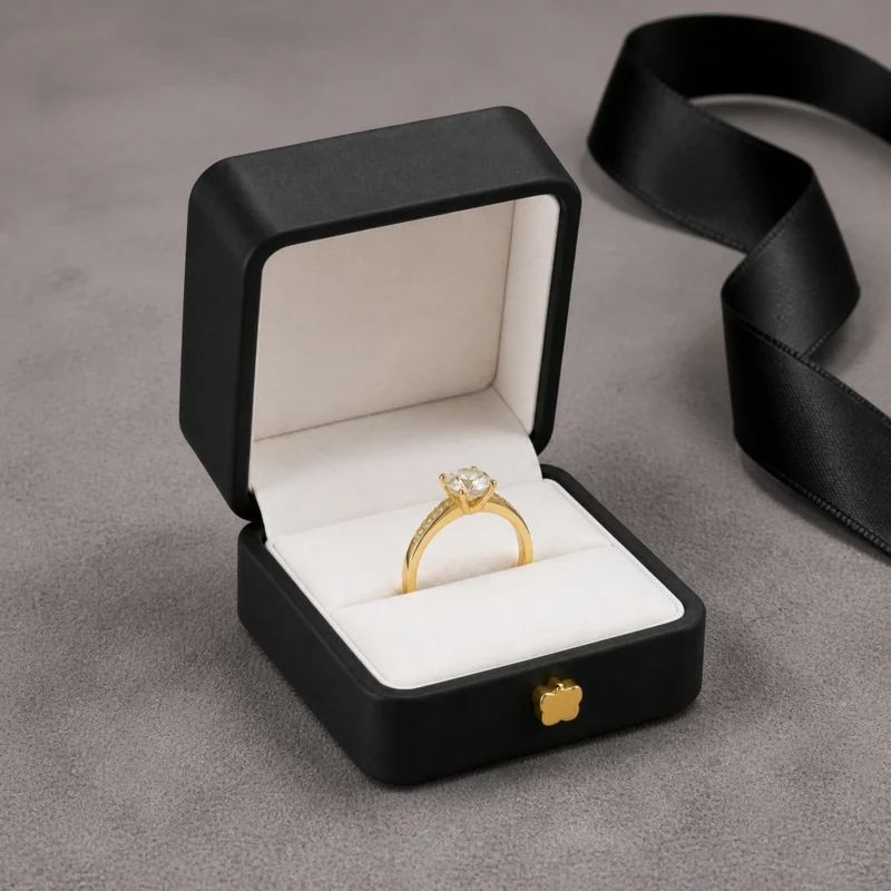 Black PU Leather Ring Box - Usage Scene Black PU leather ring box with ring in a retail presentation scene