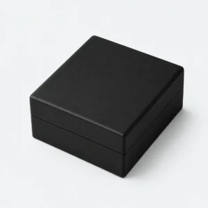 Closed black and white PU leather necklace box in an angled product view