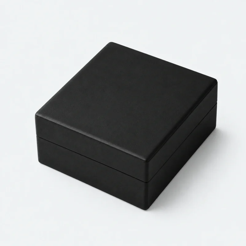Closed black and white PU leather necklace box in an angled product view